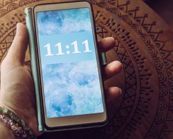 A mobile phone showing 11:11