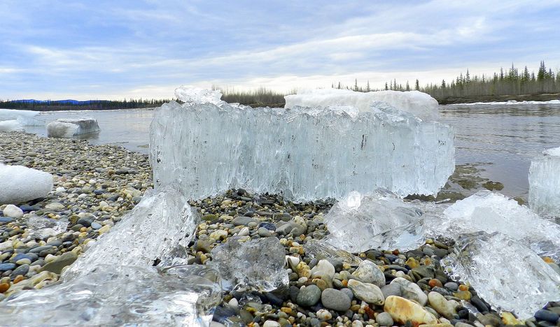 Candle ice is a form of rotten ice that develops in columns perpendicular to the surface of a lake. Rotten ice is a loose term for melting, disintigrating or ice otherwise formed with contaminants between the grains. It may appear strong but is actually very week and melts more quickly than solid ice.