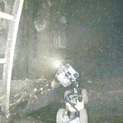 Bird's eye view of the snake-like robot peering into Unit 1 reactor of Fukushima Daiichi Nuclear Power Station, Japan.