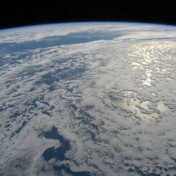 The sun's glint beams on the South Pacific Ocean as the International Space Station orbited just off the coast of New Zealand in July 2022.
