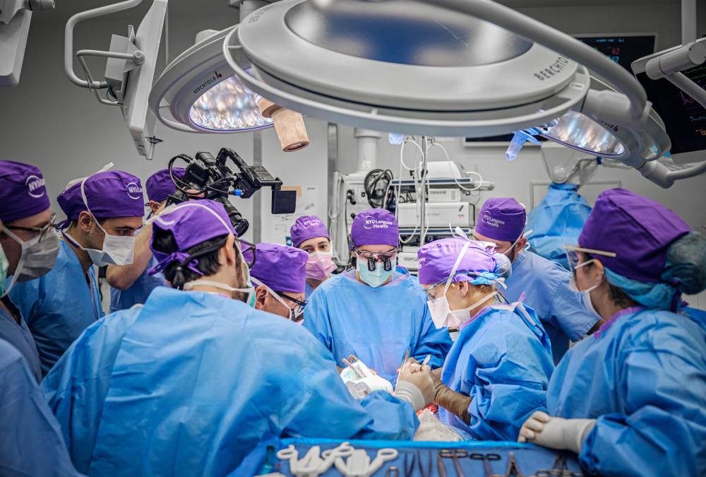 A team of surgerons and doctors carrying out a face transplant and eyeball transplant at a NYC hospital. A team of surgerons and doctors carrying out a face transplant and eyeball transplant at a NYC hospital.