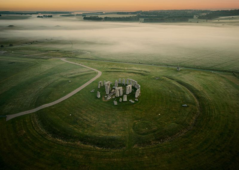 A drone shot of Stonehenge in Wiltshire, southwest England, on a misty morning.