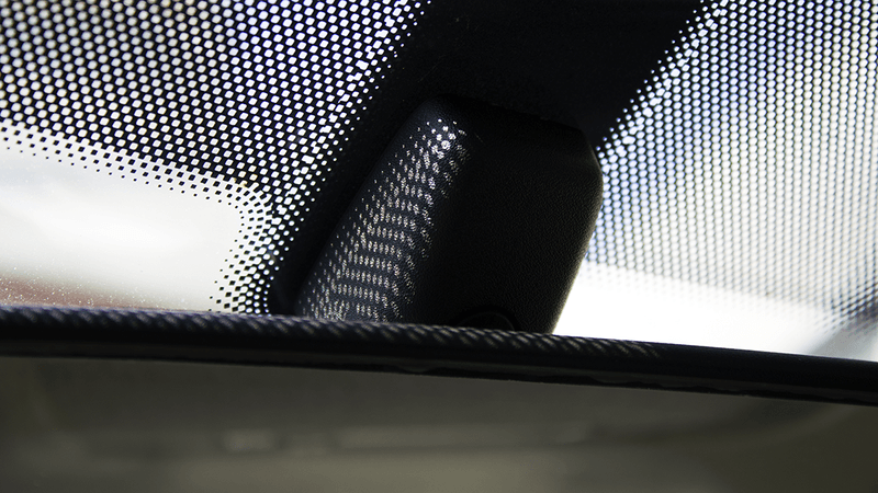 Dots on a windshield, known as a "frit".
