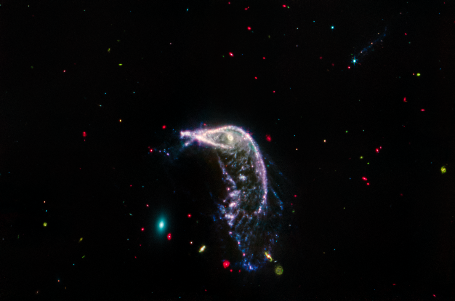 The outline of the Penguin are still visible in this image but a lot of its structure is gone. The egg is nothing but a small oval, the contribution of most of its stars beyond the telescope. The outline of the Penguin are still visible in this image but a lot of its structure is gone. The egg is nothing but a small oval, the contribution of most of its stars beyond the telescope.